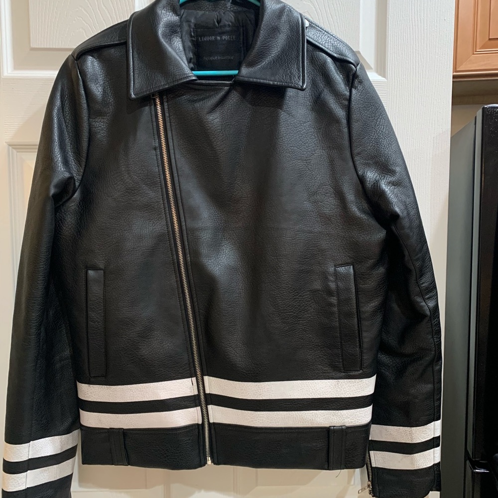 Faux Leather lined jacket. Nice detail, zippers on sleeves. Worn  a few times